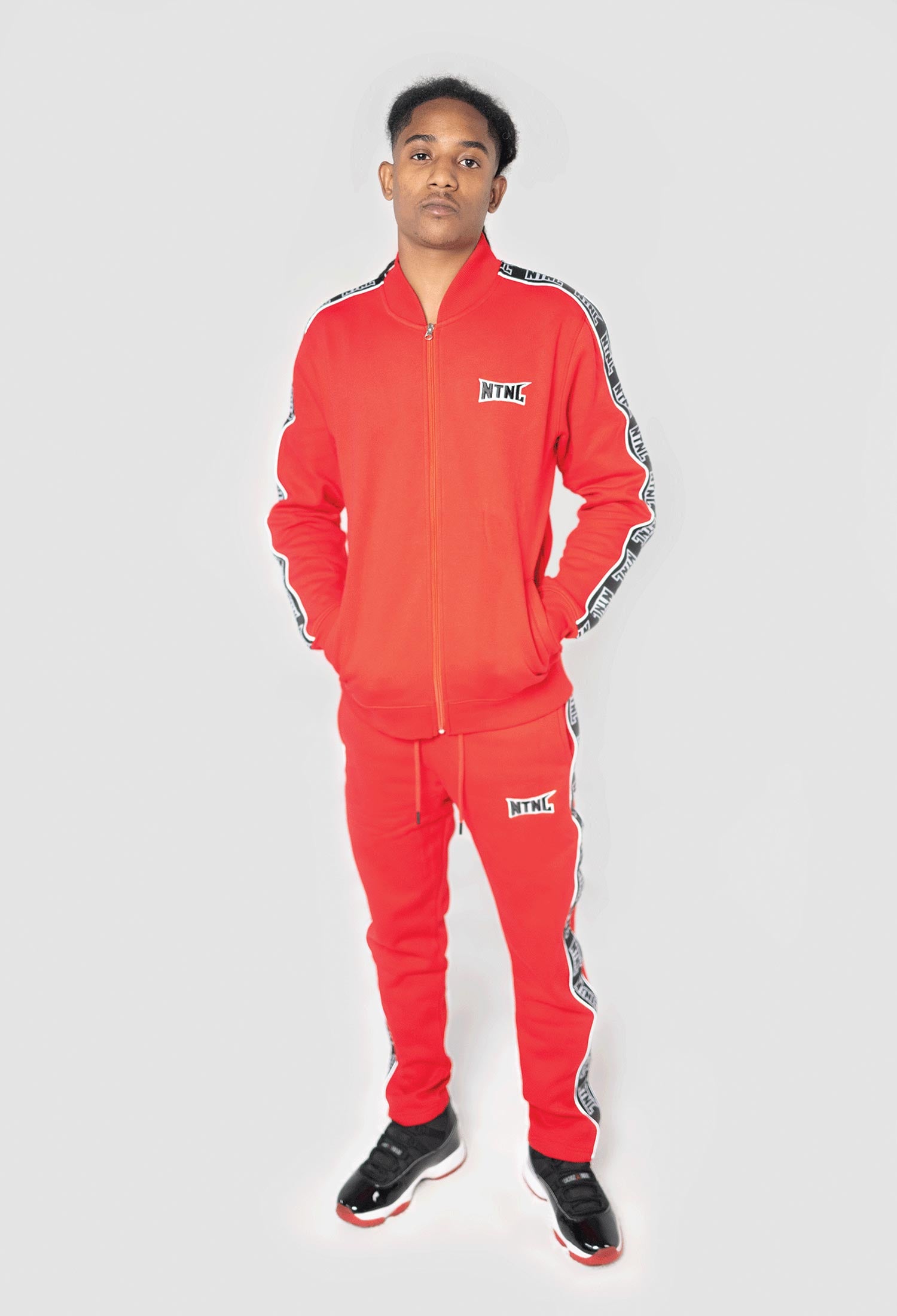 MALE MODEL WEARING SIZE S RED 3M TRACKSUIT